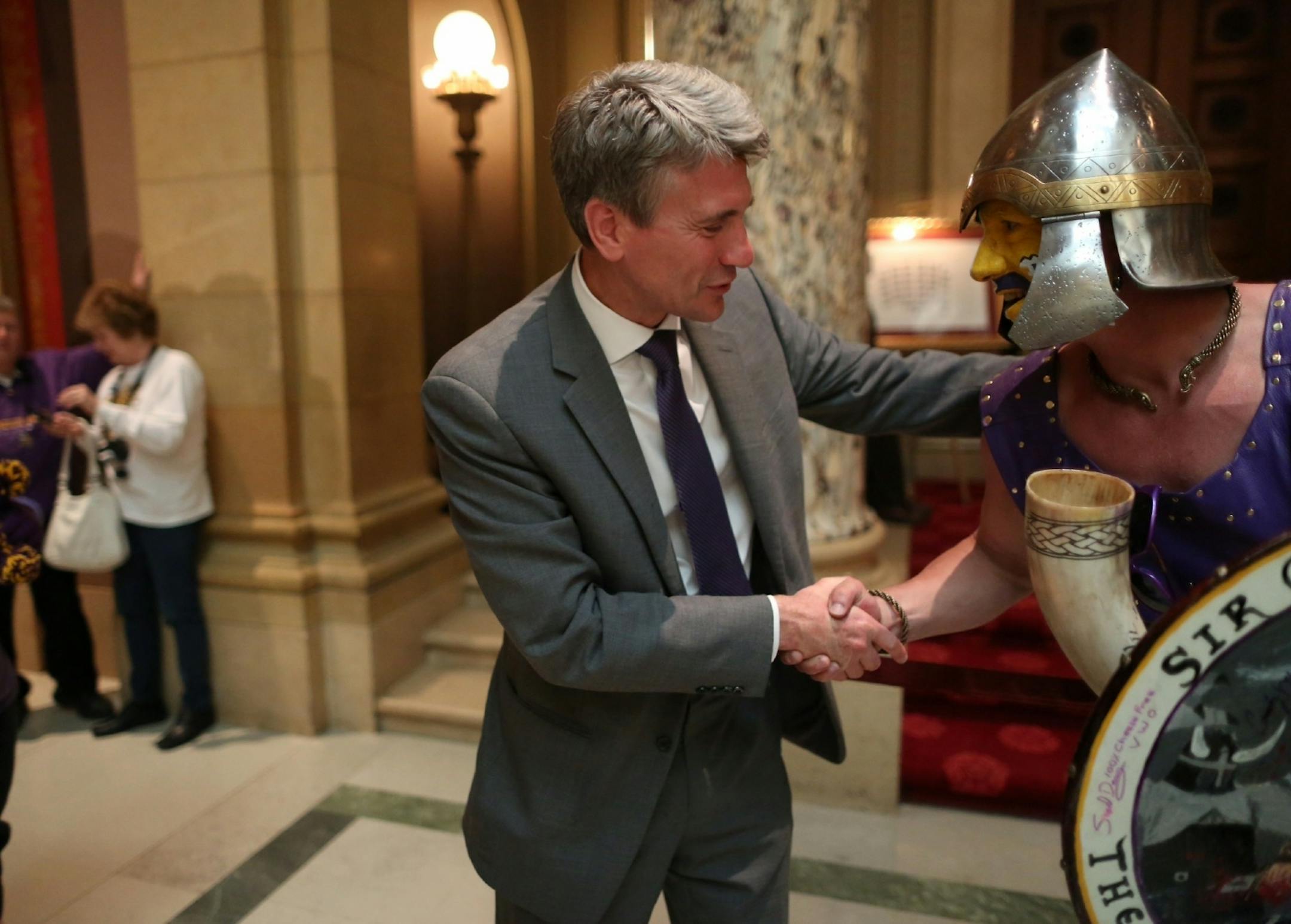 Minneapolis Mayor R.T. Rybak shook ands with Vikings fan David Gunderson in the hallway after the Vikings stadiumwas passed in the Senate on May 10, 2012 at the State Capitol in St. Paul, Minn. (RENEE JONES SCHNEIDER * reneejones@startribune.com) r.t. Rybak, david gunderson