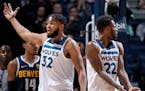 Karl-Anthony Towns (32) and Andrew Wiggins (22) of the Timberwolves question a call in the fourth quarter against the Nuggets on Nov. 10