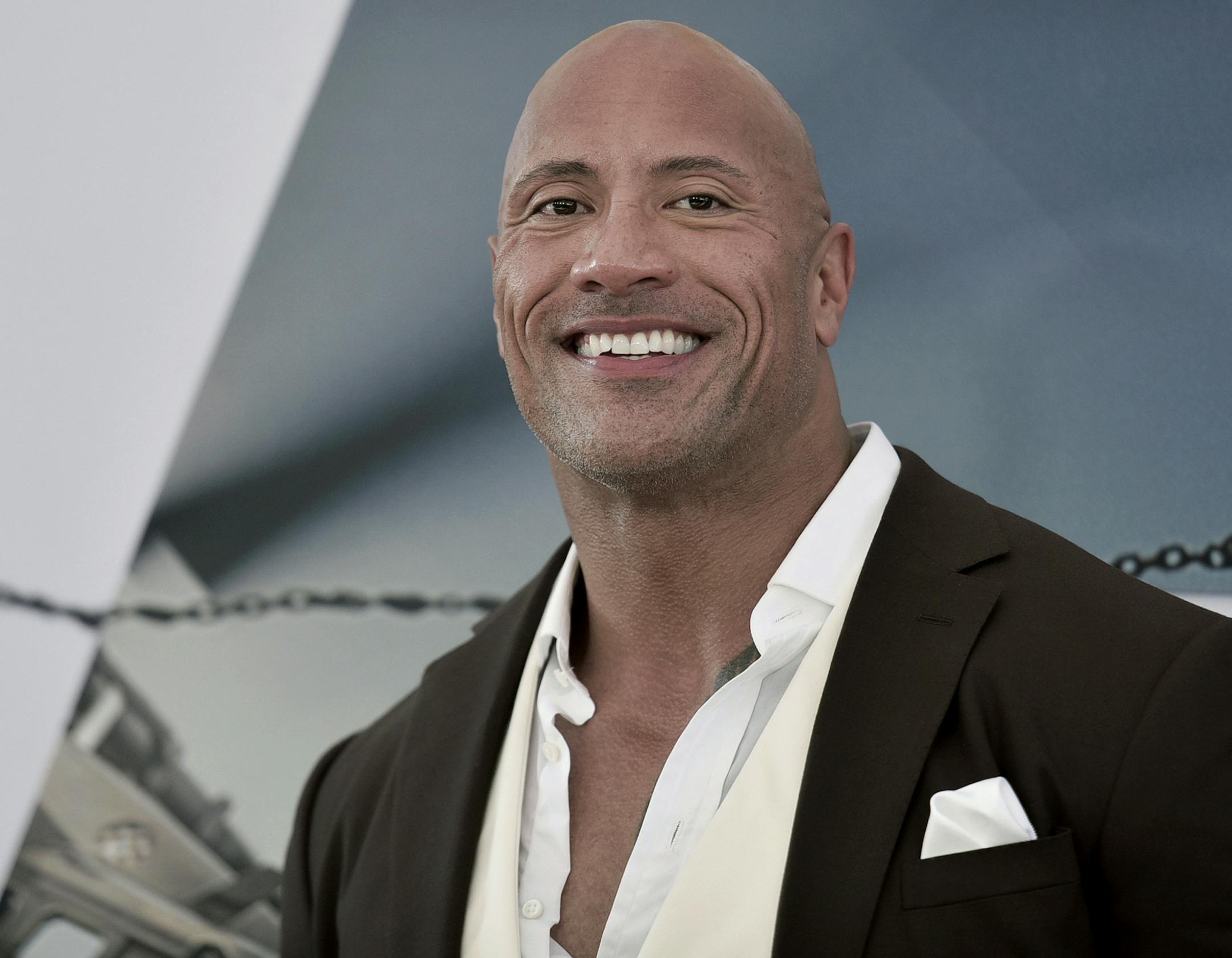 FILE - Dwayne Johnson attends the premiere of "Fast & Furious Presents: Hobbs & Shaw" on July 13, 2019, in Los Angeles. Johnson said he has acquired the XFL. The 48-year-old actor made the announcement on Twitter. Reportedly the price is $15 million. The XFL had eight franchises and played five games out of a planned 10-game schedule before canceling the remainder of its season in March because of the COVID-19 pandemic. (Photo by Richard Shotwell/Invision/AP, File)