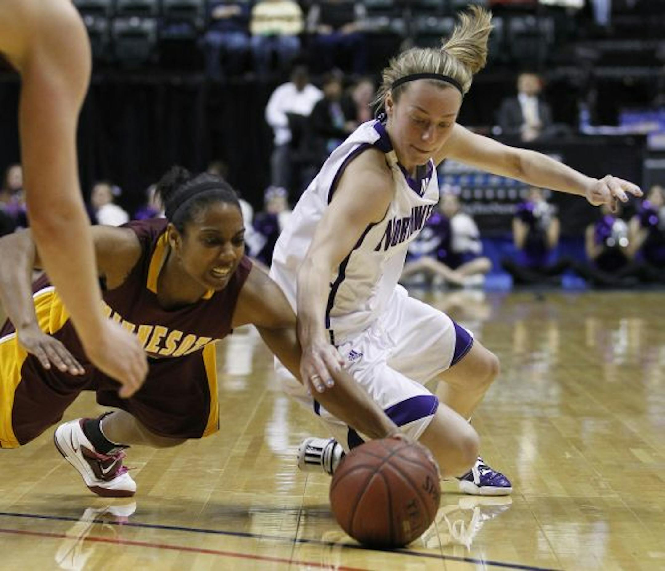 Gophers guard China Antoine knocked the ball away from Northwestern guard Beth Marshall. Antoine led the U with 18 points.