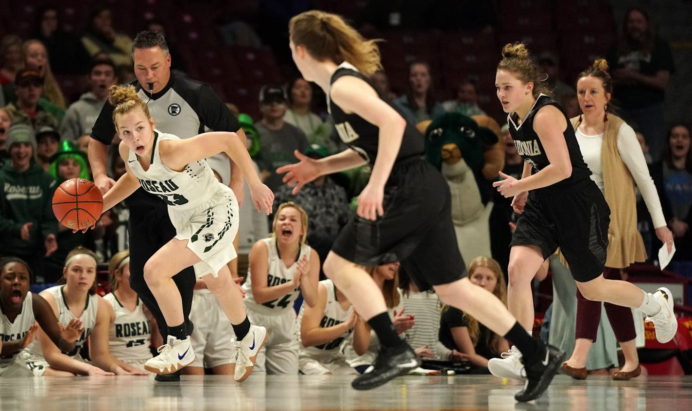 Roseau guard Katie Borowicz (23) surveyed her options as she took the ball up the court in the first half. ] ANTHONY SOUFFLE • anthony.souffle@startribune.com Caledonia High School played Roseau High School in a MSHSL Class 2A semifinal girls' basketball game Friday, March 15, 2019 at Williams Arena in Minneapolis.