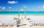 Romantic Wedding setting on the beach and blue sky. istock