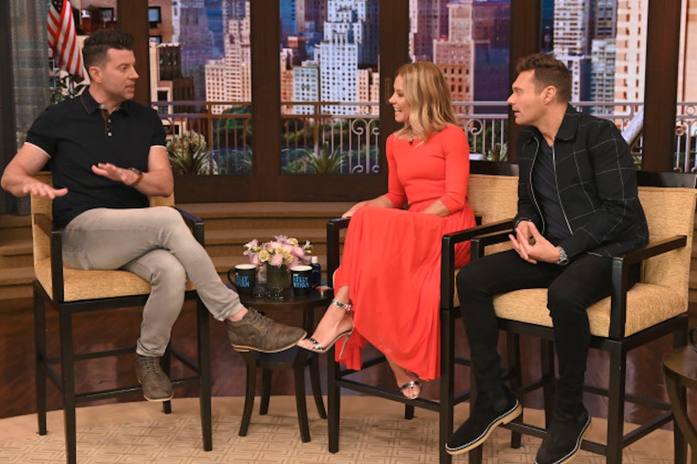 Kelly Ripa and Ryan Seacrest talk with Steve Patterson during the production of "Live with Kelly and Ryan" in New York on Wednesday, Sept. 11, 2019.