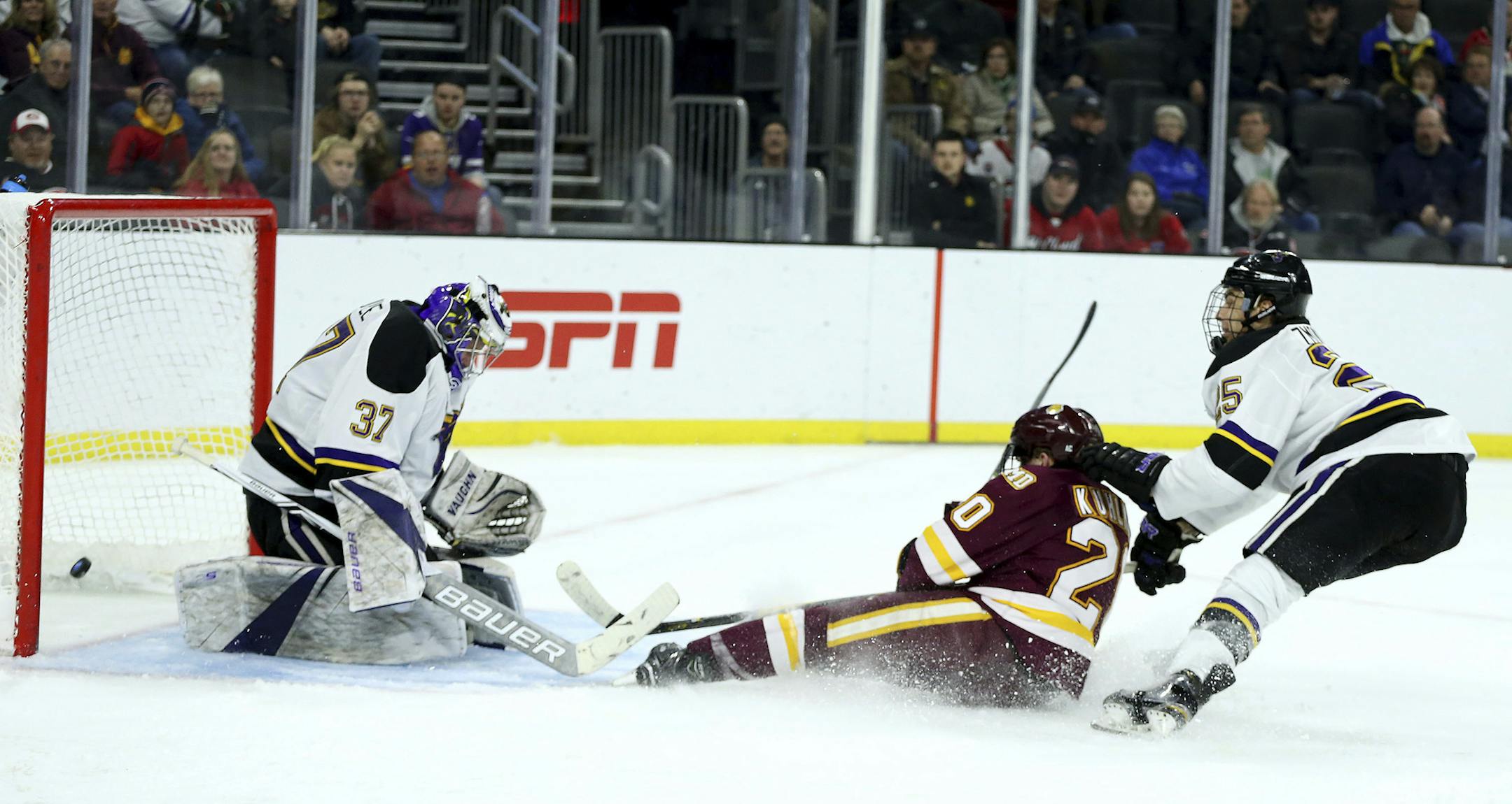 Minnesota Duluth's Karson Kuhlman (20) scores a goal past Mankato's Connor LaCouvee (37) during the second period of an NCAA regional men's college hockey tournament game, Friday, March 23, 2018, in Sioux Falls, S.D. (AP Photo/Dave Eggen)