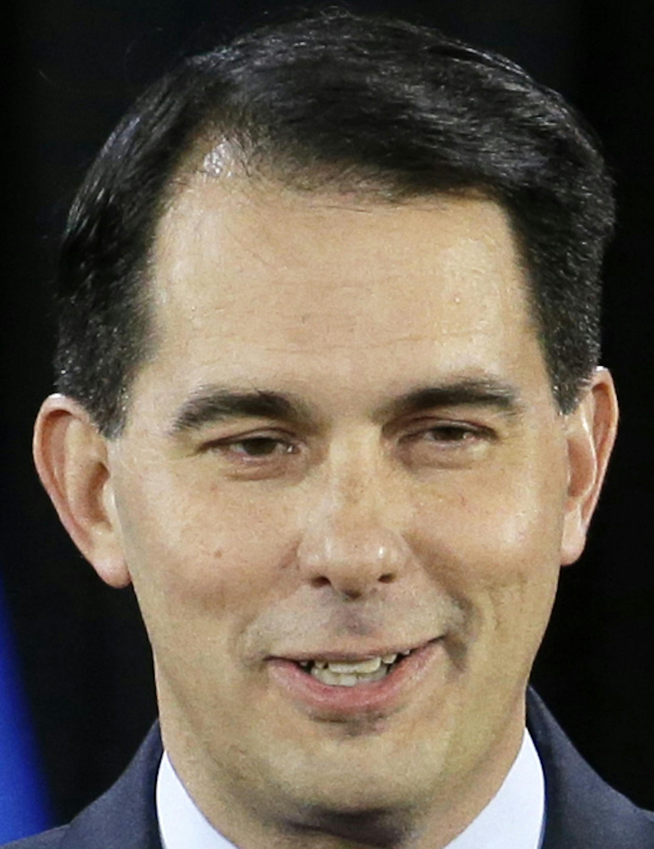 FILE - This Nov. 4, 2014, file photo show Wisconsin Republican Gov. Scott Walker giving a thumbs up as he speaks at his campaign party, in West Allis, Wis. Gov. One group of potential candidates for president probably wonít be shuffling off to Iowa, New Hampshire or other early campaign spots in the new year. Theyíll be hunkered down in statehouses across the Midwest, pushing bills through their legislatures. Few outside their home states will notice, but these governors and their poli