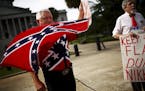 A demonstrator waves a Confederate battle flag outside the South Carolina State House in Columbia, S.C., July 6, 2015. The South Carolina State Senate