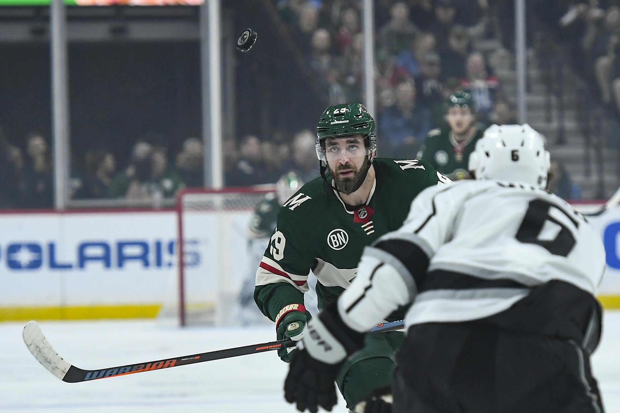 Minnesota Wild defenseman Greg Pateryn (29) eyed the puck in the first period while moving against Los Angeles Kings defenseman Jake Muzzin (6).