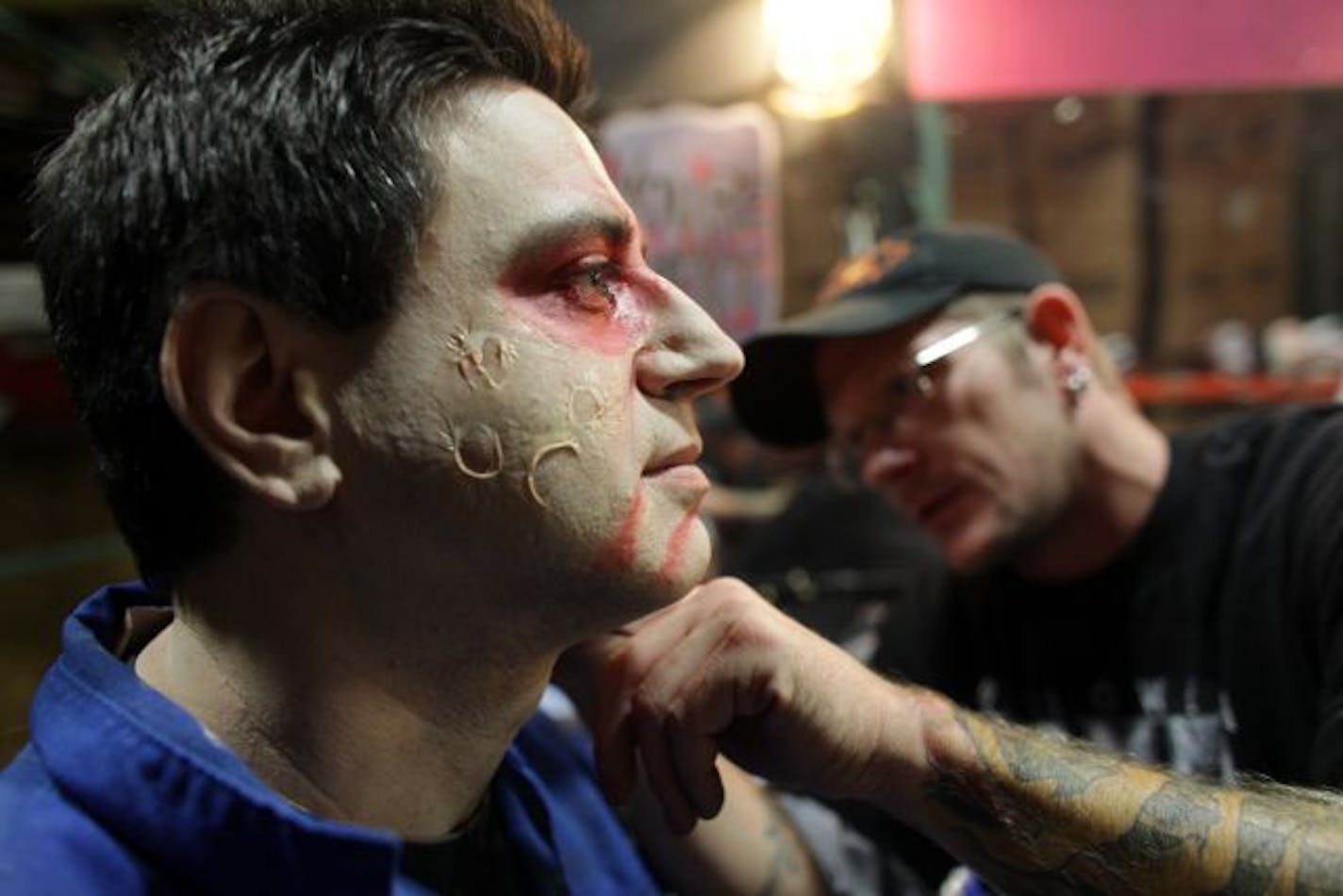 The Star Tribune's Randy Salas got made up by Erik Rux, of Rosemount, as Salas prepared to play his role of zombie at Valleyfair's "Valleyscare".