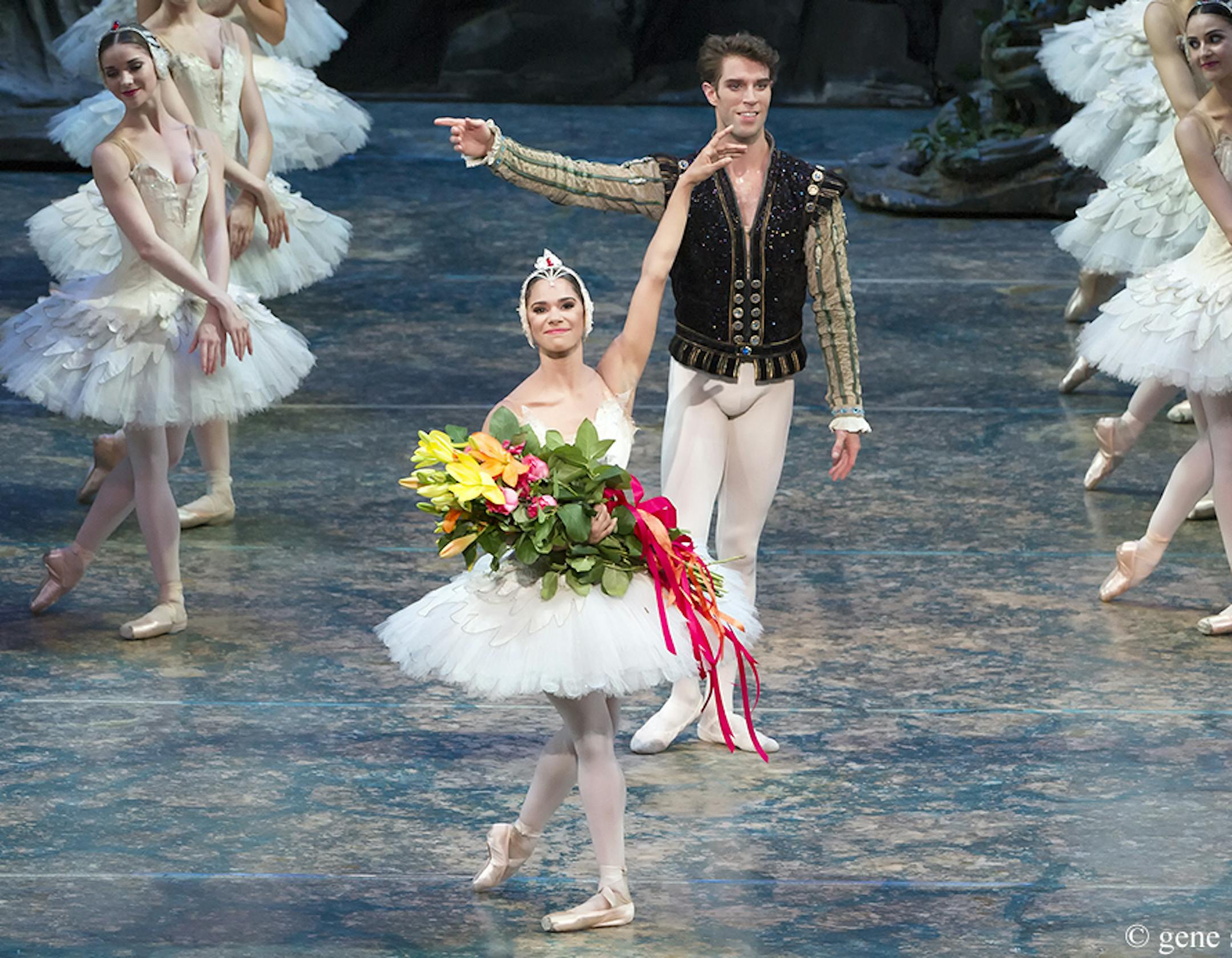 FILE - In this June 24, 2015 photo provided by American Ballet Theater, Misty Copeland and James Whiteside acknowledge the audience after appearing in "Swan Lake" at the Metropolitan Opera House in New York. On Tuesday, June 30, 2015, Copeland was named American Ballet Theater's first black principal dancer. (Gene Schiavone/American Ballet Theater via AP)