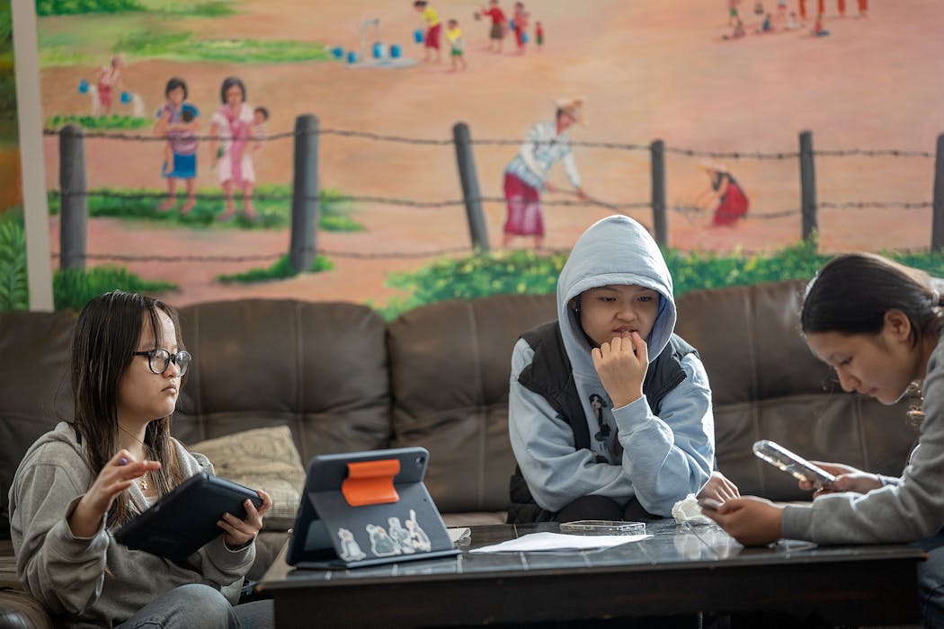Humboldt High School students work on their homework at the Urban Village in St. Paul on March 26.