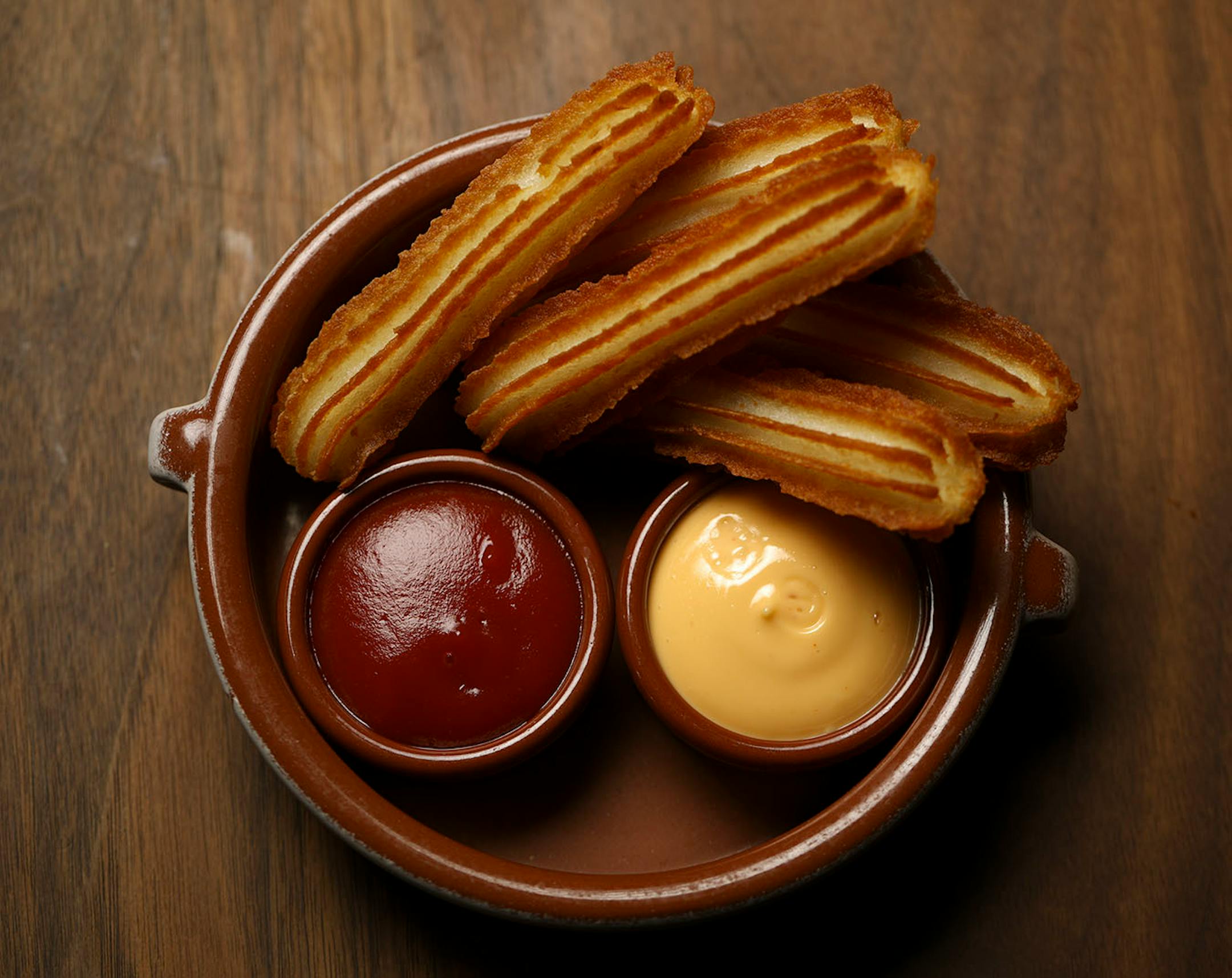 Potato churros, with spicy mayo and ketchup, as prepared at Martina Wednesday evening.