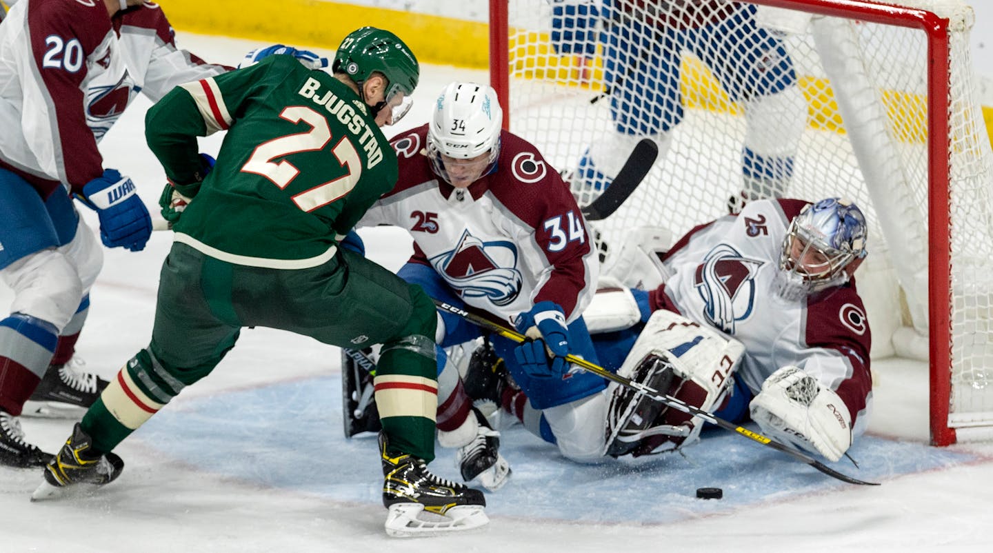 Colorado goalie Philipp Grubauer stops a shot by Nick Bjugstad of the Wild on Monday night. The Wild lost their fifth game in regulation to Colorado 5-4 despite a comeback in the third period.