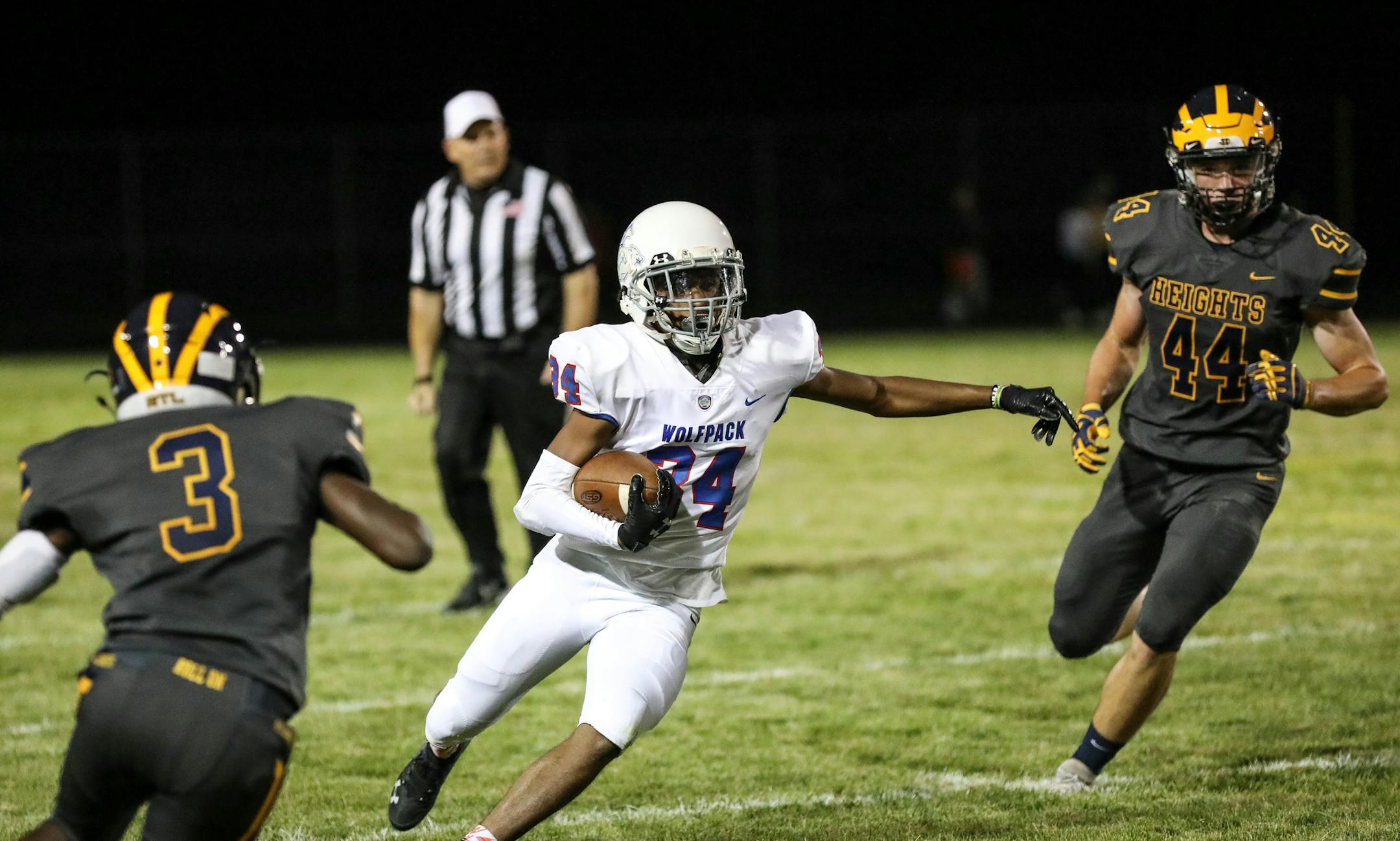 SMB's Dewayne Givens (34) winds through two defenders on his way to the end zone. Givens scored two touchdowns helping SMB defeat Columbia Heights 35-17 on Friday night. Photo by Cheryl A. Myers, SportsEngine