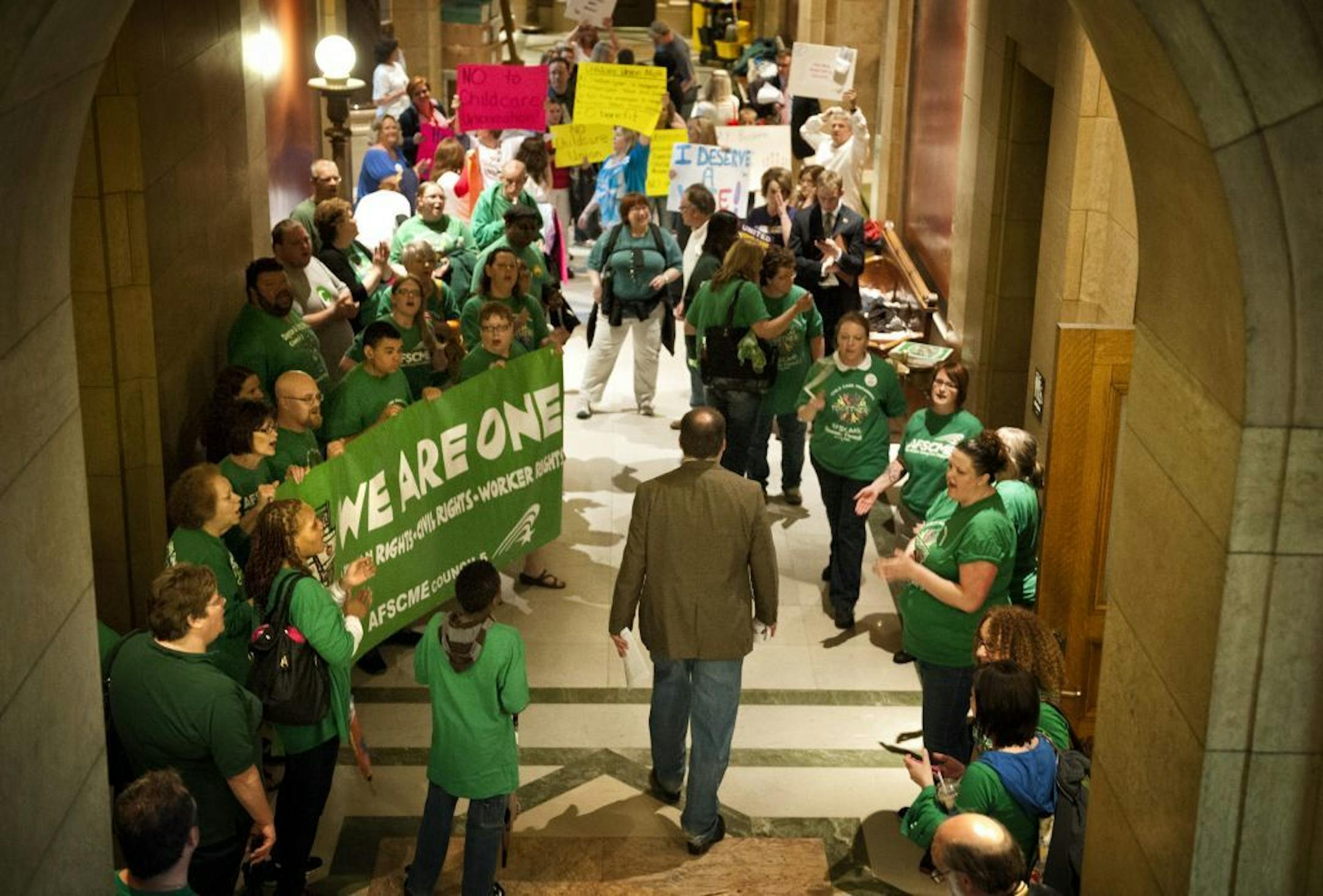 Assistant Minority Leader Kelby Woodard, R-Belle Plaine walked through the gauntlet of cheering advocates for both sides of the daycare unionization demonstrators. Vote Yes and Vote No echoed in throughout the Capitol Saturday, May 18, 2013 as legislators were set to debate the childcare unionization bill.