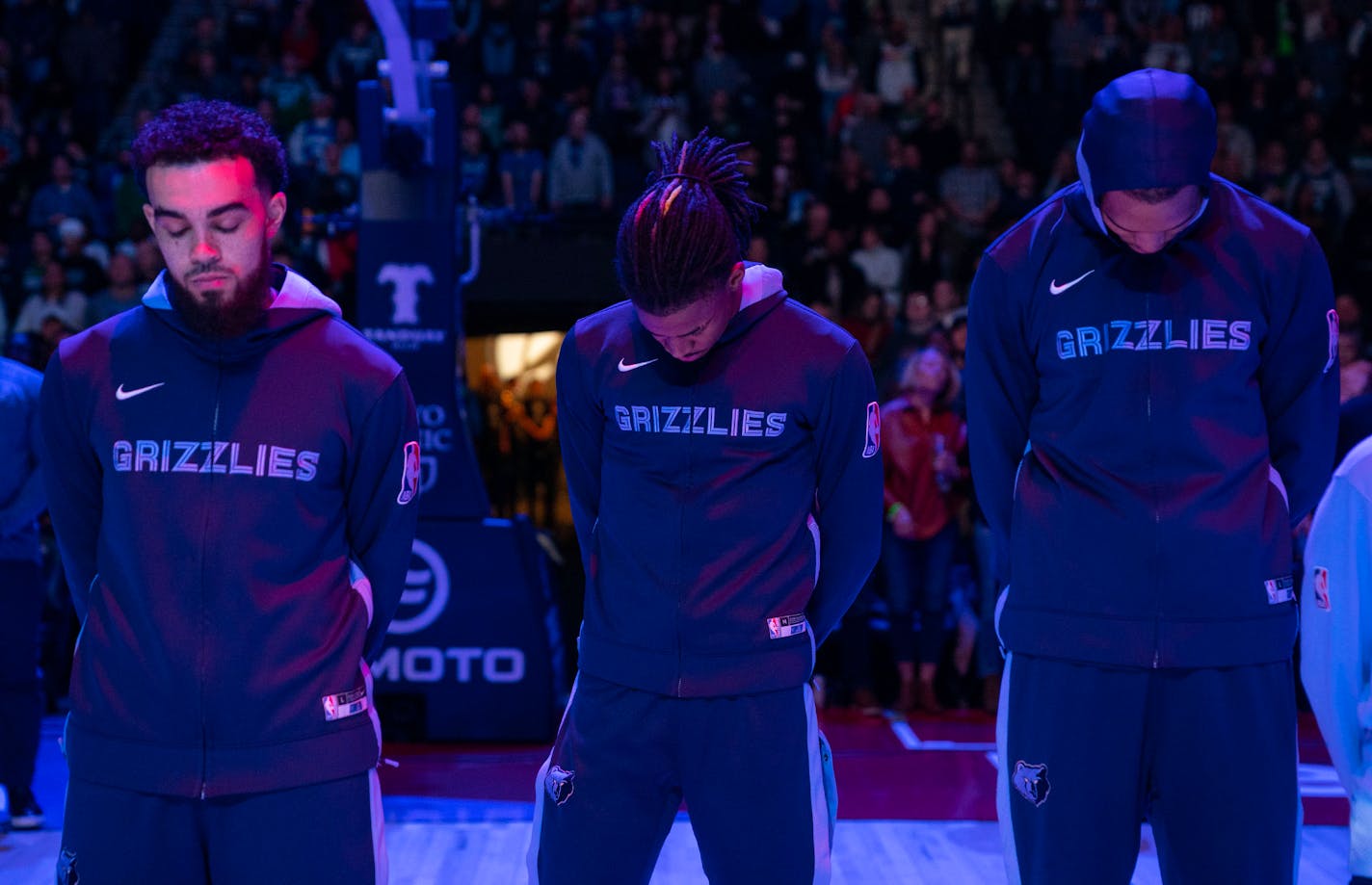 Memphis Grizzlies players bowed their heads in a moment of silence to honor Tyre Nichols ahead of their game against the Minnesota Timberwolves Friday, Jan. 27, 2023 at Target Center in Minneapolis. ]