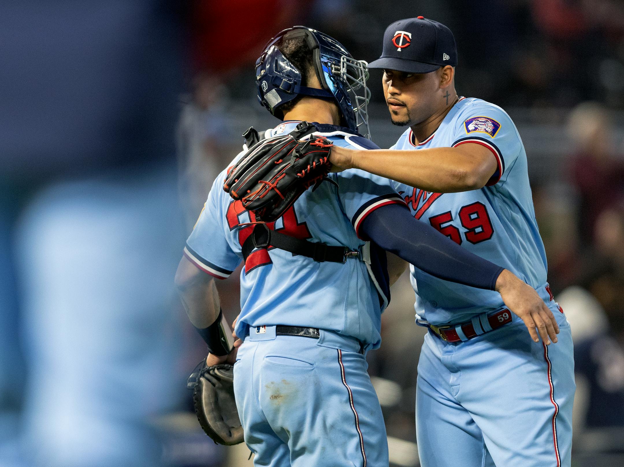 Gary Sanchez and Jhoan Duran of the Minnesota Twins celebrate at the end of the game.