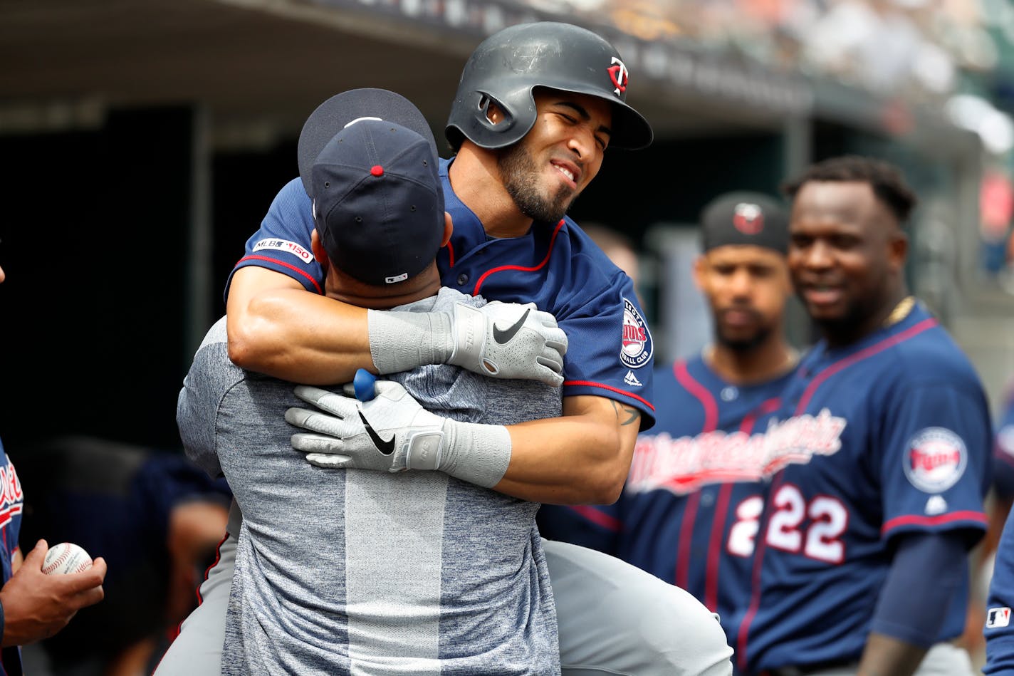 Eddie Rosario put a big hug around Jonathan Schoop after hitting the last of the Twins' four home runs Sunday, a solo shot that was Rosario's 19th of the season.