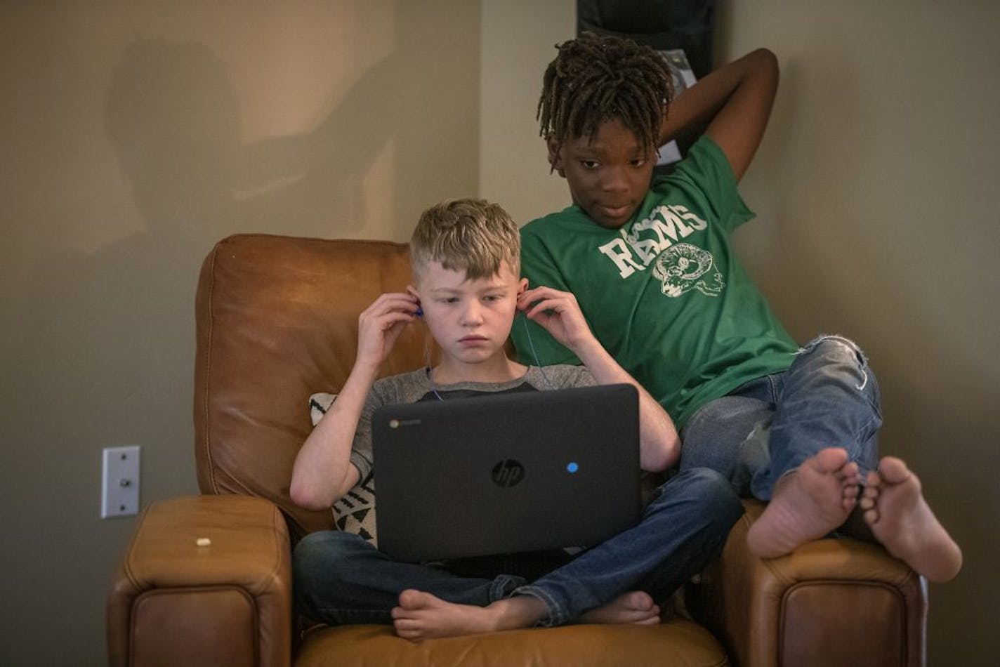 Brothers Ridge, 9, and Nelson Lundquist, 11, worked on school work, Sept. 29, 2020 in Brooklyn Park.