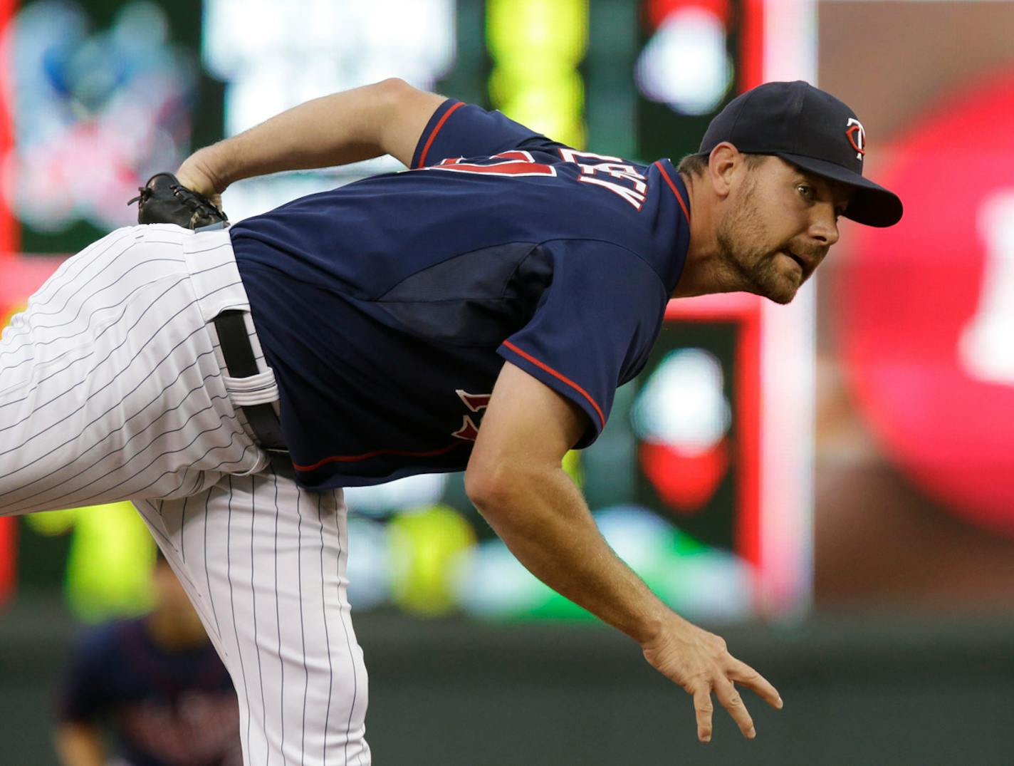 Minnesota Twins pitcher Mike Pelfrey throws against the Toronto Blue Jays in the first inning of a baseball game, Friday, Sept. 6, 2013 in Minneapolis. (AP Photo/Jim Mone)