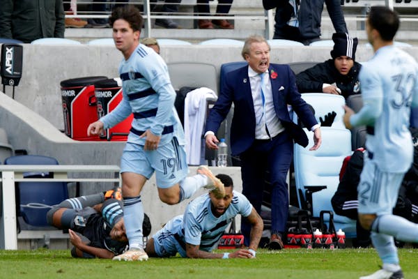 Minnesota United coach Adrian Heath yelled after Emanuel Reynoso, bottom left, was tackled by Sporting Kansas City defender Amadou Dia in October 2021
