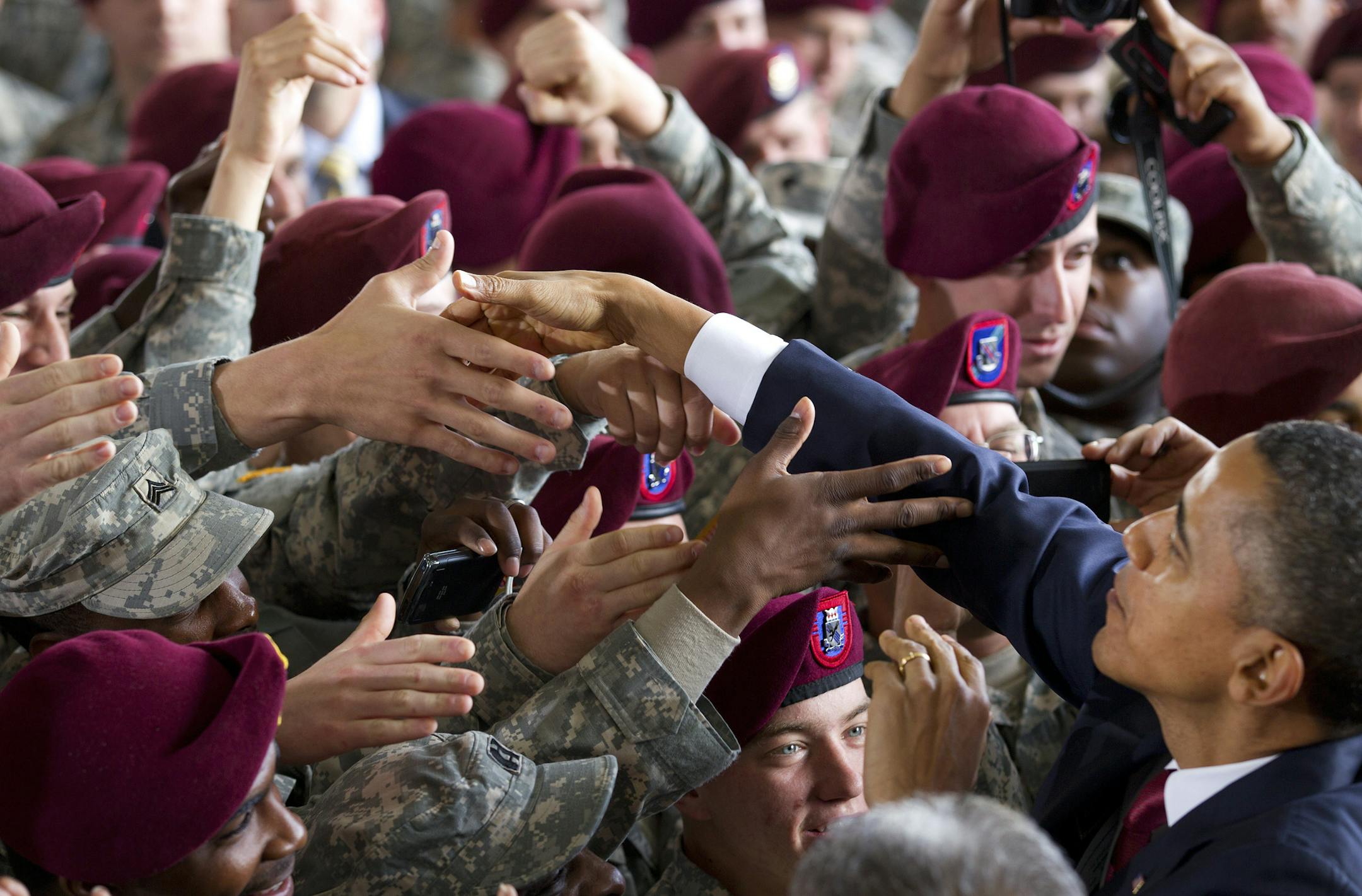 President Barack Obama greets troops during a visit with first lady Michelle Obama at Fort Bragg, N.C., Dec. 14, 2011. On Wednesday, the president and his wife visited the base to mark the end of the Iraq war by paying tribute to U.S. troops for their service. (Doug Mills/The New York Times)