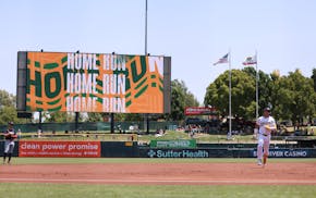 The Athletics' Max Muncy rounds the bases after hitting a three-run homer Thursday against the Twins at Sutter Health Park, the A's temporary Sacramen
