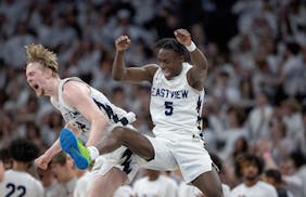 Eastview's Chet Kloss, left, and Elias Batala celebrate their 72-68 win over Minnetonka.