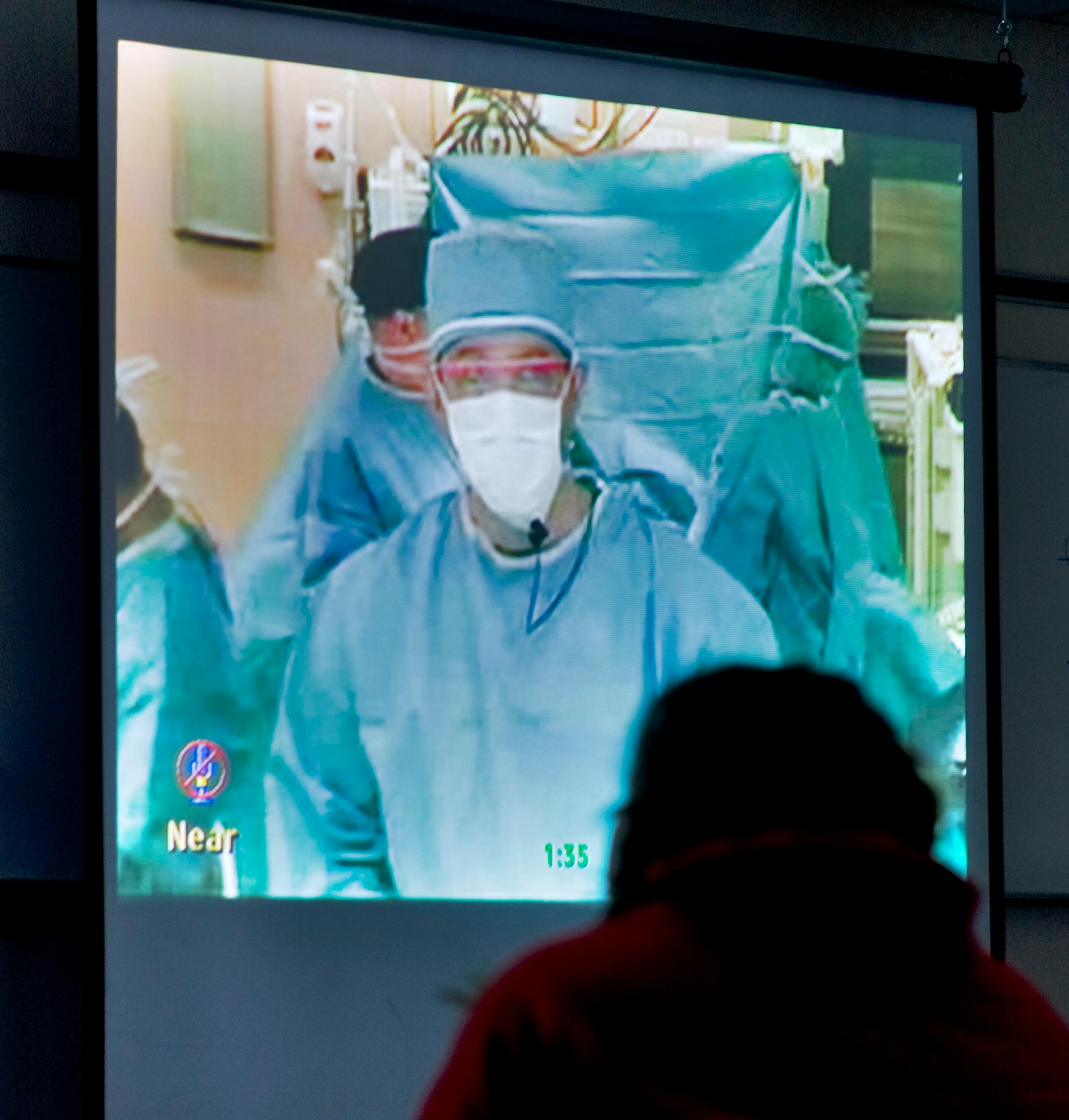 Dr. Joel R. Politi, speaking from the operating room at Mount Carmel Hospital in Columbus, Ohio, answered a few students' questions during the surgery.