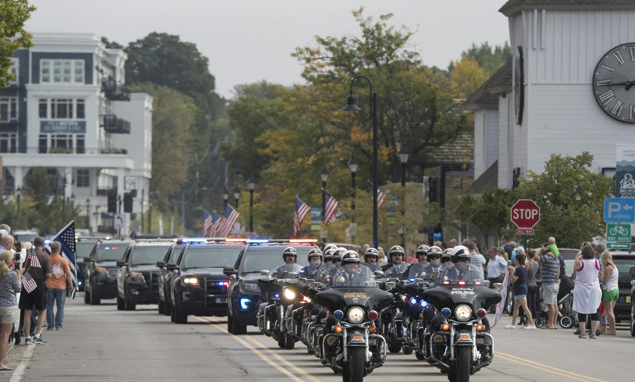 The funeral processions for Wayzata Police Officer Bill Mathews passed by Lake Minnetonka to Summit Park Cemetery were he will be buried Thursday September 14,2017 in Wayzata, MN.