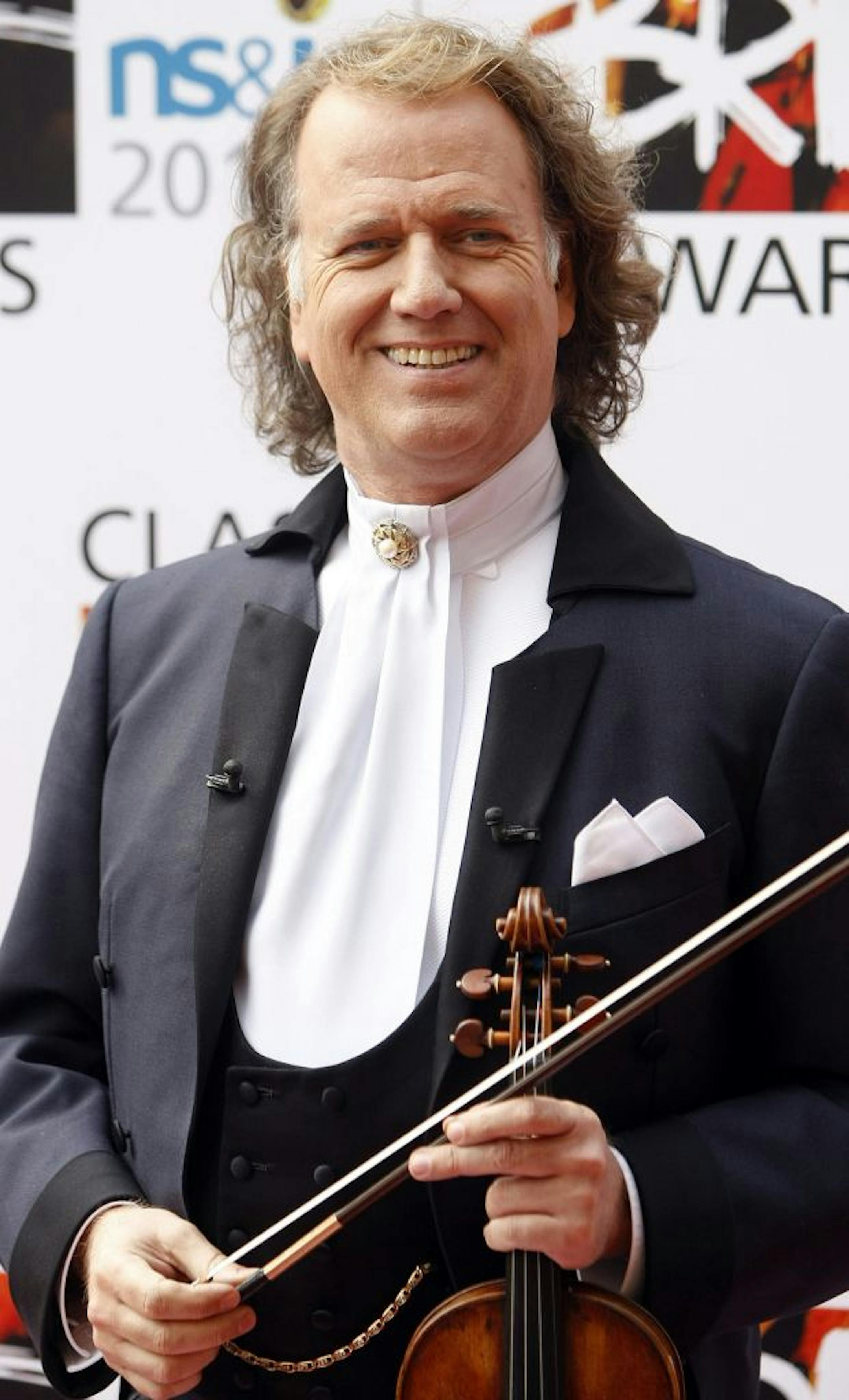 Dutch violinist and conductor Andre Rieu poses for the cameras at the Classical music Brit Awards, at the Royal Albert Hall in London, Thursday, May, 13, 2010.