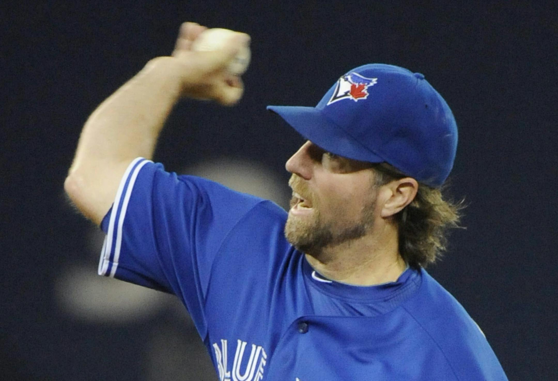 Toronto Blue Jays starter R.A. Dickey pitches against the Kansas City Royals during the first inning of a baseball game in Toronto on Saturday, Aug. 31, 2013. (AP Photo/The Canadian Press, Jon Blacker) ORG XMIT: MIN2013090520495856