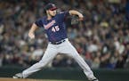 Minnesota Twins starter Phil Hughes delivers a pitch during the first inning of a baseball game against the Seattle Mariners, on Saturday, May 28, 201