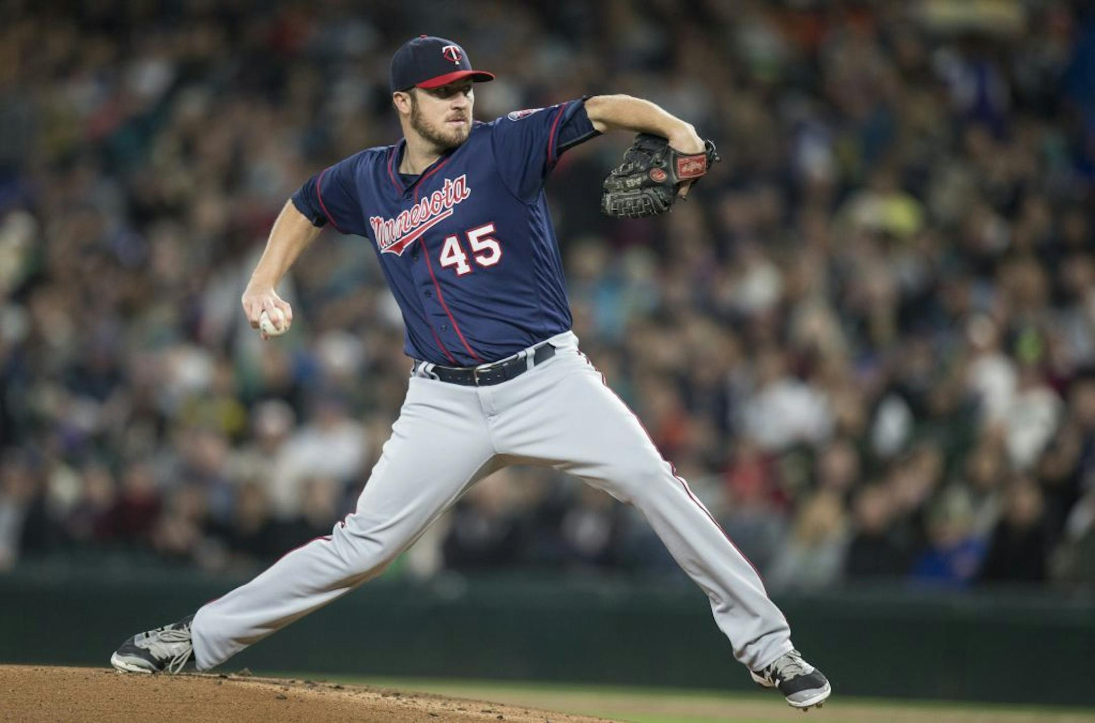 Minnesota Twins starter Phil Hughes delivers a pitch during the first inning of a baseball game against the Seattle Mariners, on Saturday, May 28, 2016, in Seattle.