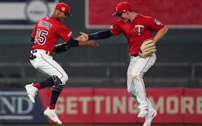 Minnesota Twins center fielder Byron Buxton (25) celebrated with Minnesota Twins right fielder Max Kepler (26) in the outfield after the win.
