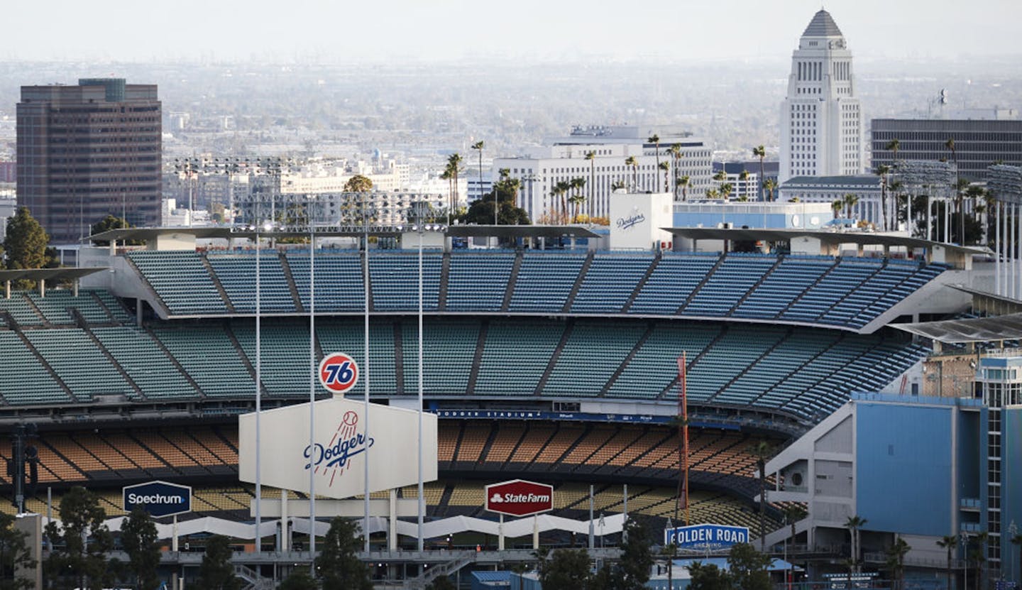 Dodger Stadium on what was supposed to be Major League Baseball's Opening Day in March, now postponed because of the coronavirus pandemic. MLB owners are now proposing an 80-game season