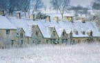 The famous Arlington Row in Bibury, The Cotswolds, dusted with January snow