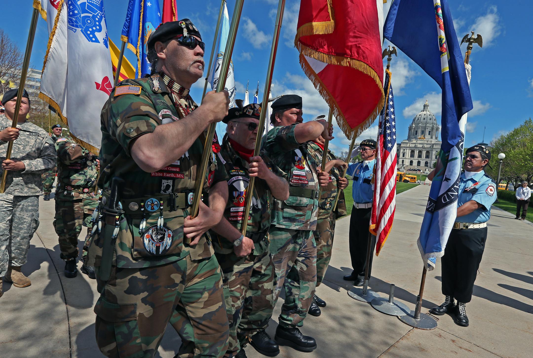 A tribal honor guard of American Indian Veterans marched on the Capital Court of Honor at the end of the plaque ceremony honoring American Indian Veterans on 5/22/14. Tribal Leaders, Governor Dayton and Commissioner spoke at Plaque Ceremony Honoring American Indian Veterans St Paul, On May 22, 2014 and thereafter, American Indian Veterans will be honored with a memorial plaque placed on the state Capitol grounds. The plaque will be dedicated to all American Indian Veterans who have served bravel