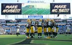 Green Bay Packers quarterback Aaron Rodgers (12) huddles with the team during the second half.