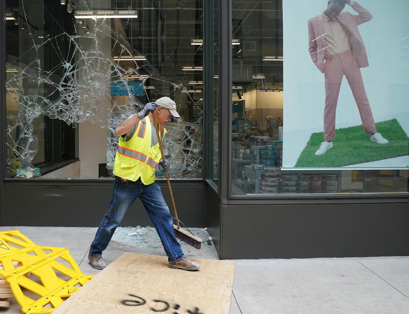 Crews worked to board up the broken windows at the Nordstrom Rack on Nicollet Mall that was one of several businesses damaged by a group of looters Wednesday night after the suicide of a homicide suspect on the Mall ignited rioting. ] ANTHONY SOUFFLE • anthony.souffle@startribune.com Community members and business owners cleaned up the damaged on Nicollet Mall caused by a group of looters Wednesday night after the suicide of a homicide suspect on the Mall ignited rioting causing the Minnesota Na