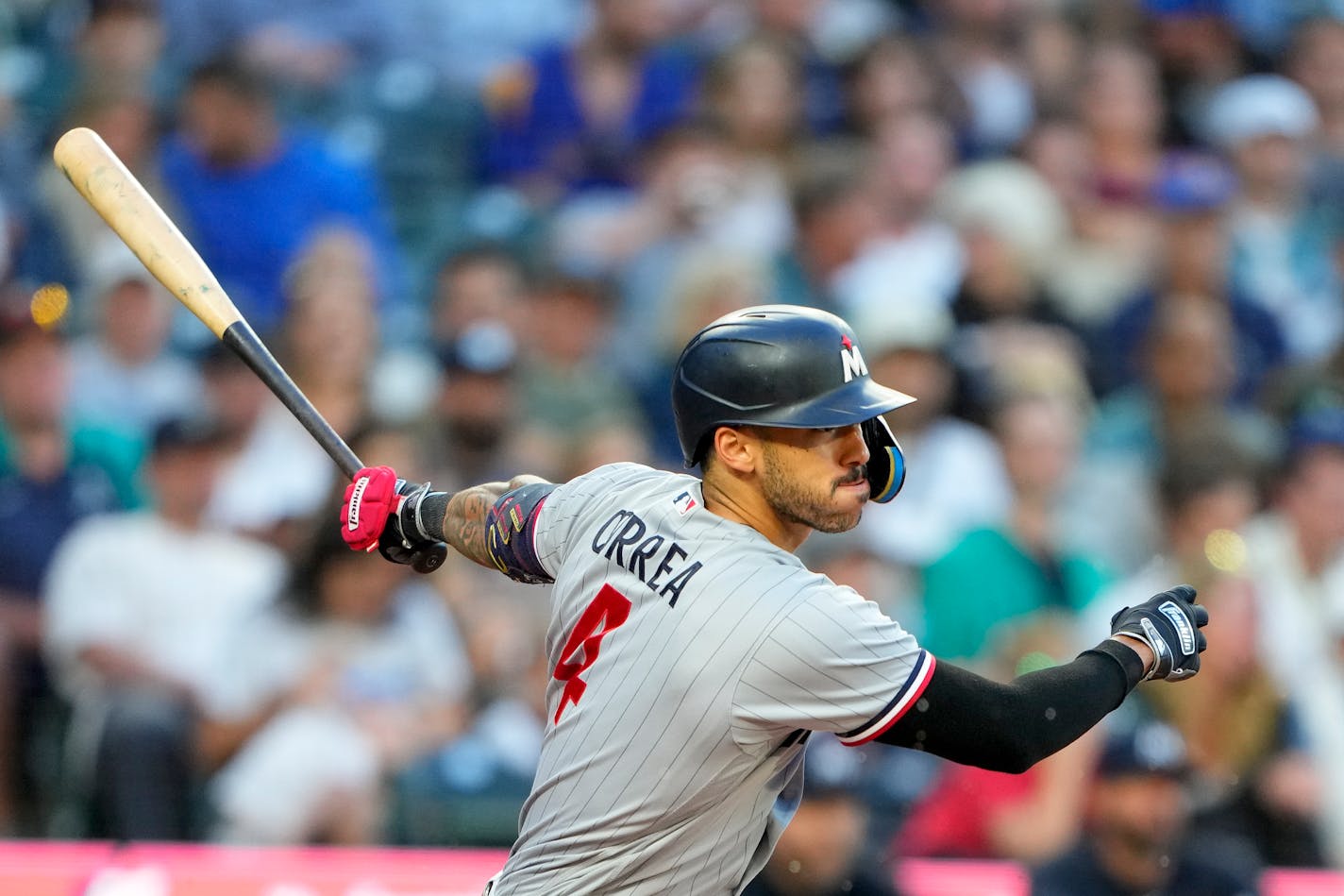 Minnesota Twins' Carlos Correa swings against the Seattle Mariners during a baseball game, Tuesday, July 18, 2023, in Seattle. (AP Photo/Lindsey Wasson)