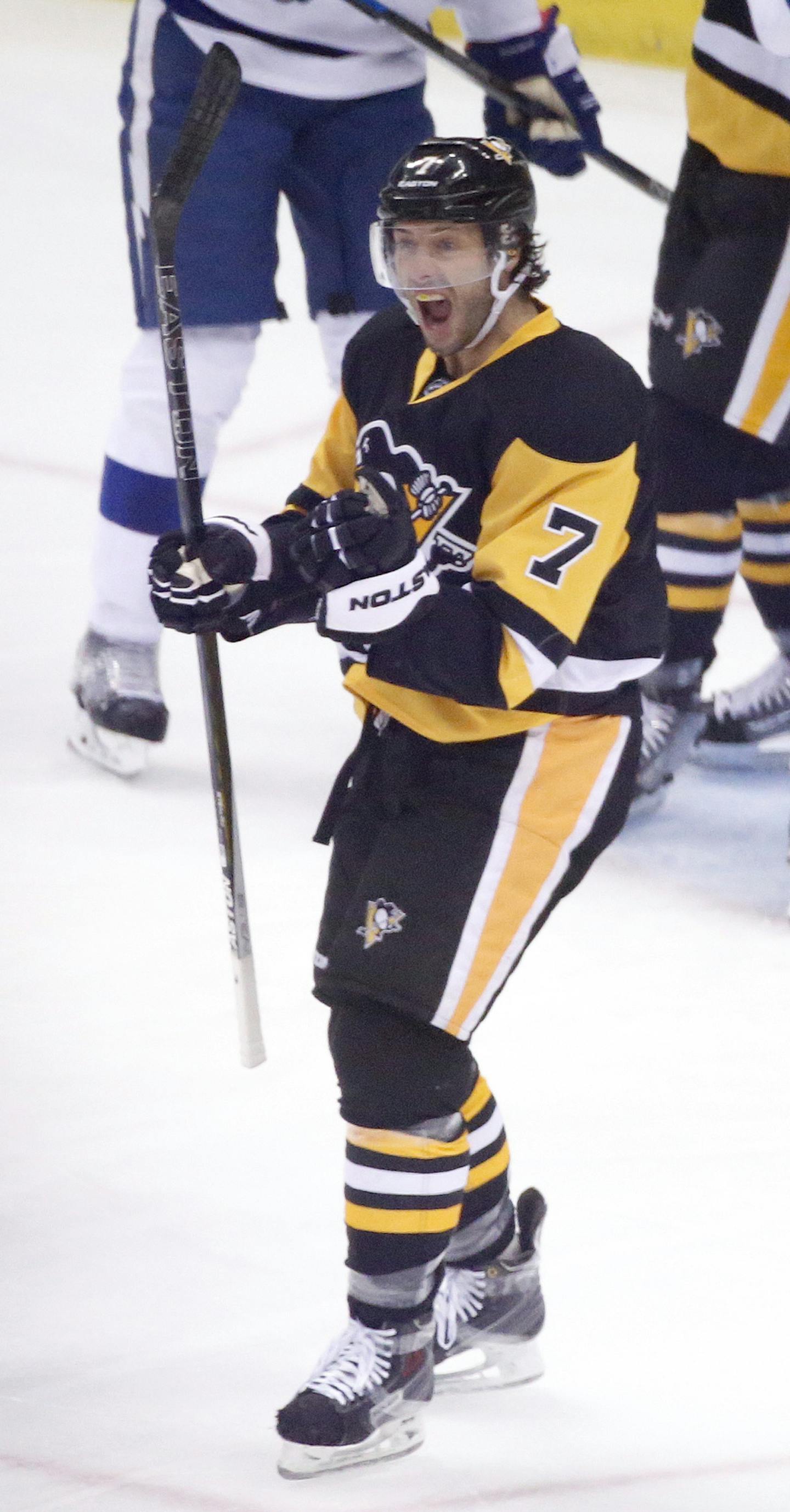 Pittsburgh Penguins' Matt Cullen (7) celebrates in front of Tampa Bay Lightning's Victor Hedman (77) and Anton Stralman (6) after scoring during the first period of Game 2 of the NHL hockey Stanley Cup Eastern Conference finals, Monday, May 16, 2016, in Pittsburgh. (AP Photo/Gene J. Puskar) ORG XMIT: PAKS102