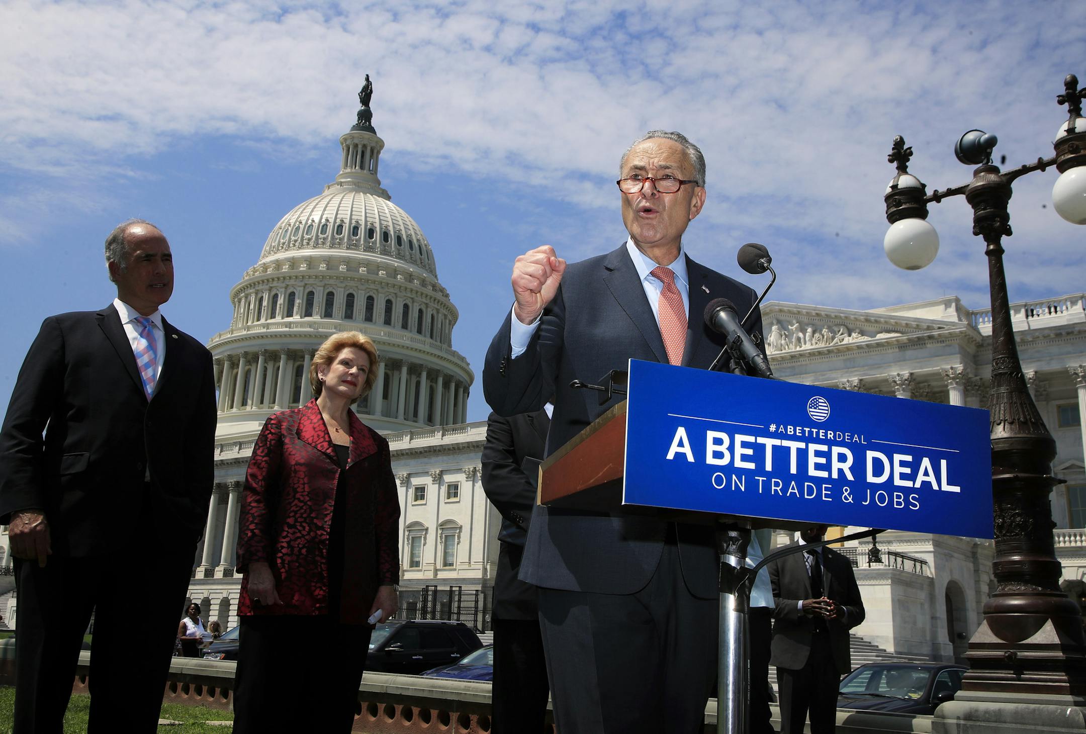 Senate Minority Leader Chuck Schumer of N.Y., accompanied by, from left, Sen. Bob Casey, D-Pa., and Sen. Debbie Stabenow, D-Mich., speaks on Capitol Hill in Washington, Wednesday, Aug. 2, 2017, to unveil "A Better Deal On Trade and Jobs," to put American workers first and fight back against companies that outsource jobs and countries that manipulate trade laws. (AP Photo/Manuel Balce Ceneta)