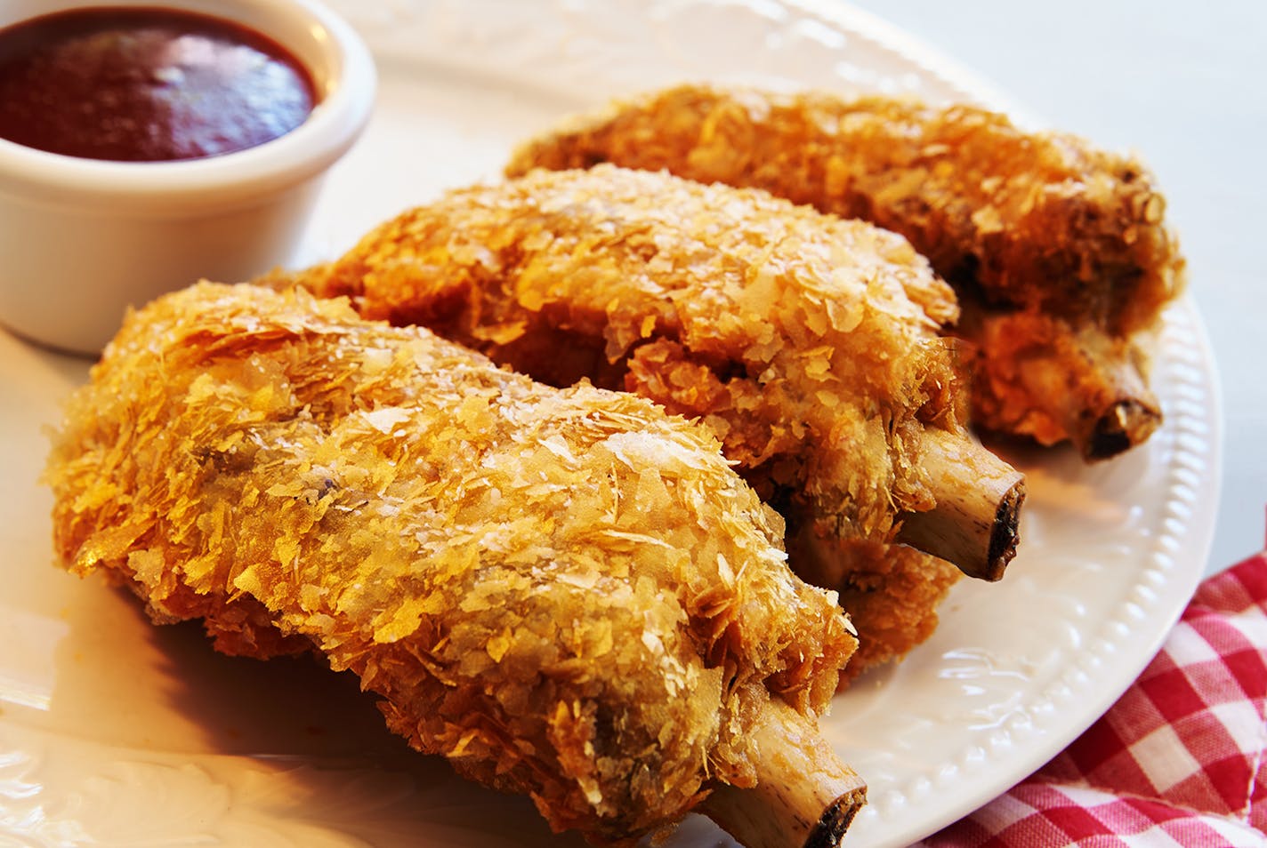 Deep Fried Ribs: Smoked baby back ribs, breaded, fried and served with BBQ sauce. Find it at Ball Park Cafe located on the east side of Underwood Street between Dan Patch and Carnes avenues outside The Garden.