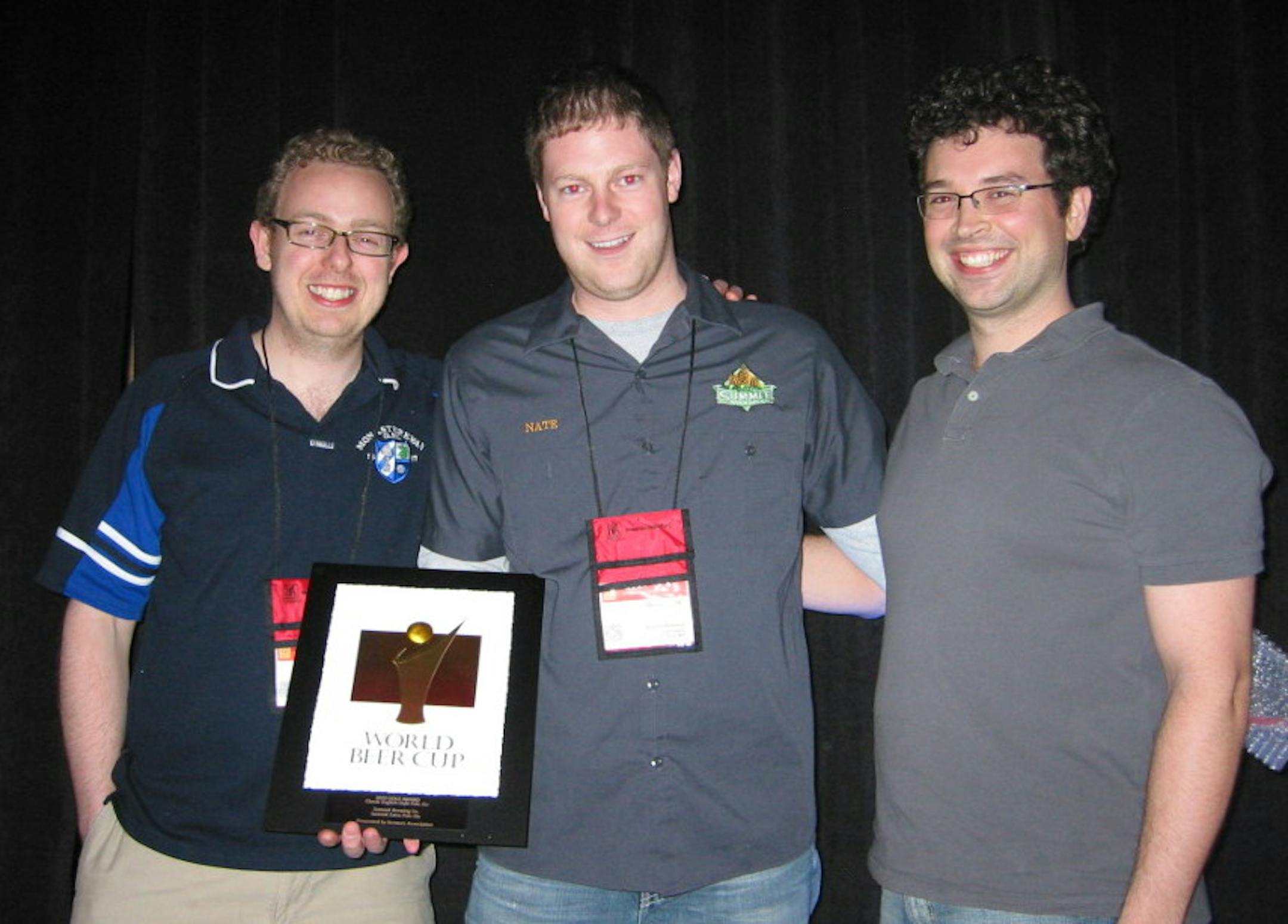 Damian McConn, Nate Siats and Eric Harper of Summit Brewing with the World Beer Cup gold medal.