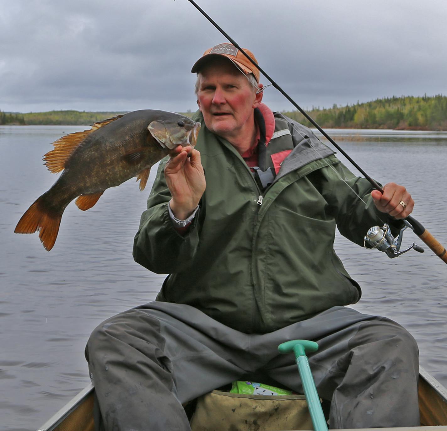 Dennis Anderson with a danday smallmouth bass taken while fishing on an overcasst, occasionally rainy Thursday in the BWCA.