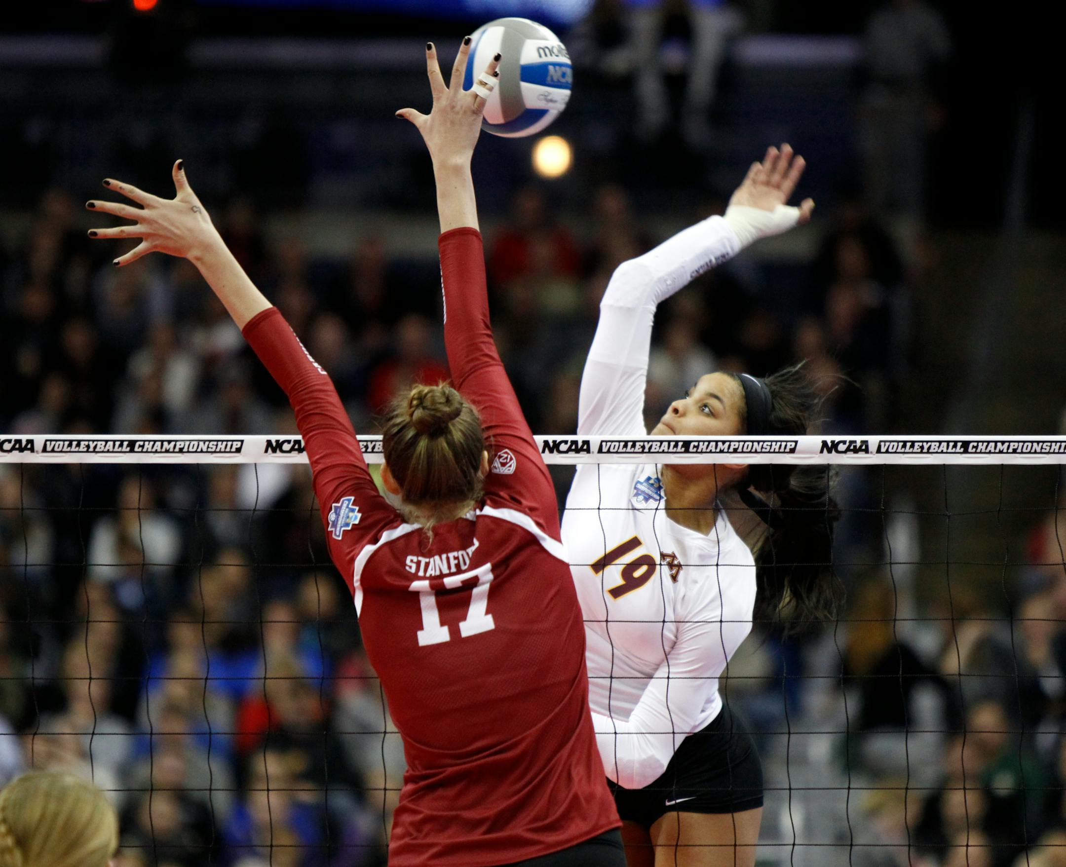 Outside hitter Alexis Hart (in white) and the Gophers moved from No. 2 to No. 1 in this week's American Volleyball Coaches Association poll, reaching the top spot for the first time since October 2016.