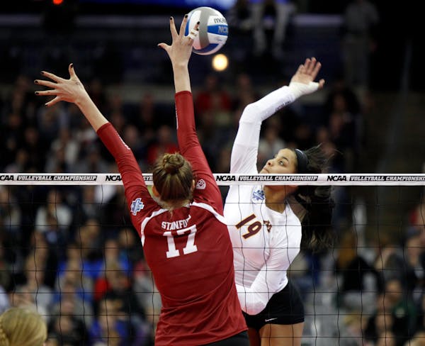 Outside hitter Alexis Hart (in white) and the Gophers moved from No. 2 to No. 1 in this week's American Volleyball Coaches Association poll, reaching 