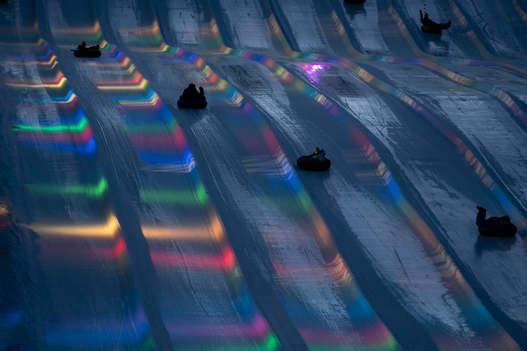 Snow tubers raced down the hill as the lights of illuminate the track at Buck Hill in Burnsville.