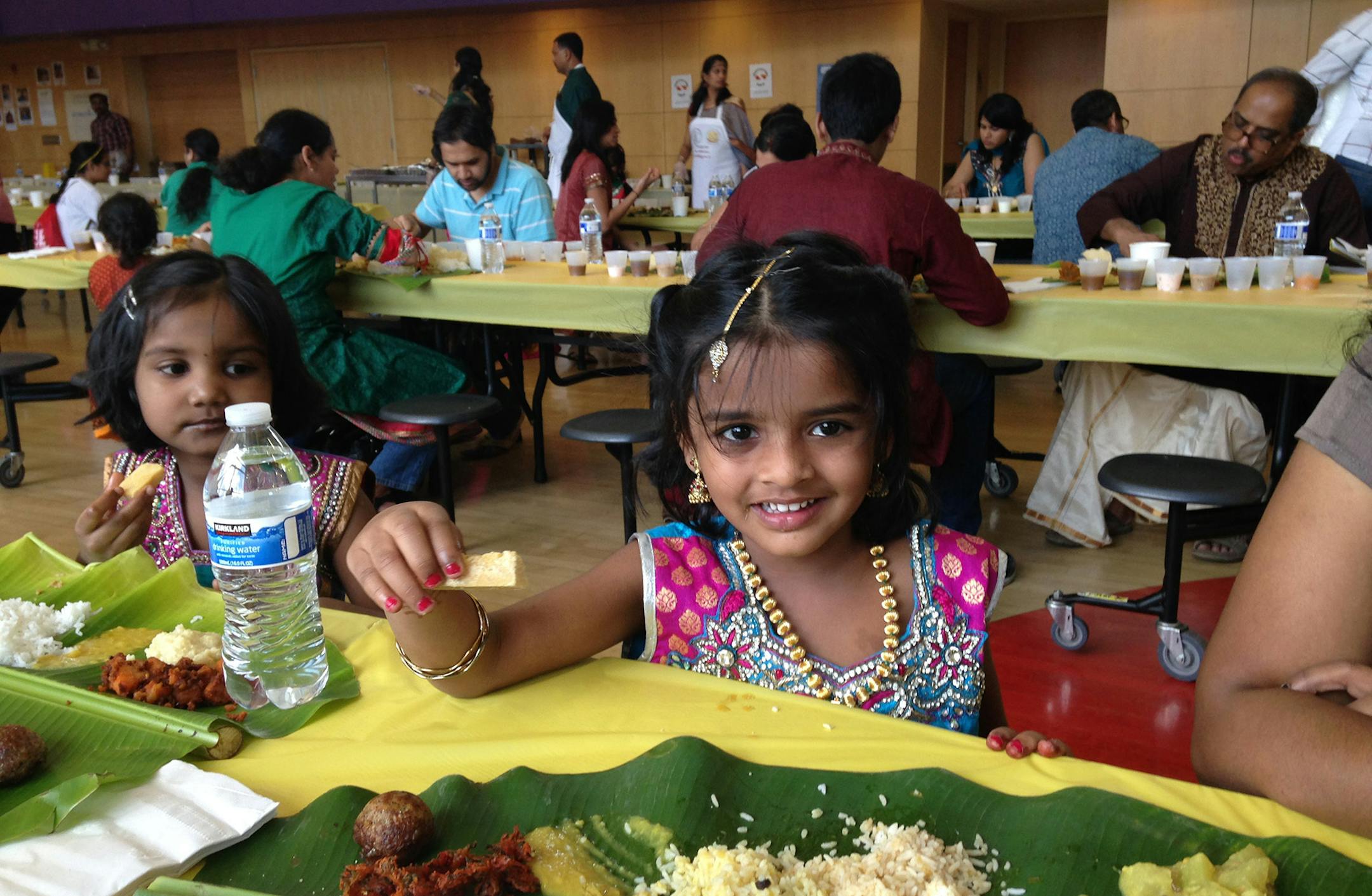 Credit: Lee Svitak Dean Tamil immigrants celebrate spring with vegetarian feast in Hopkins, which was enjoyed by all ages.