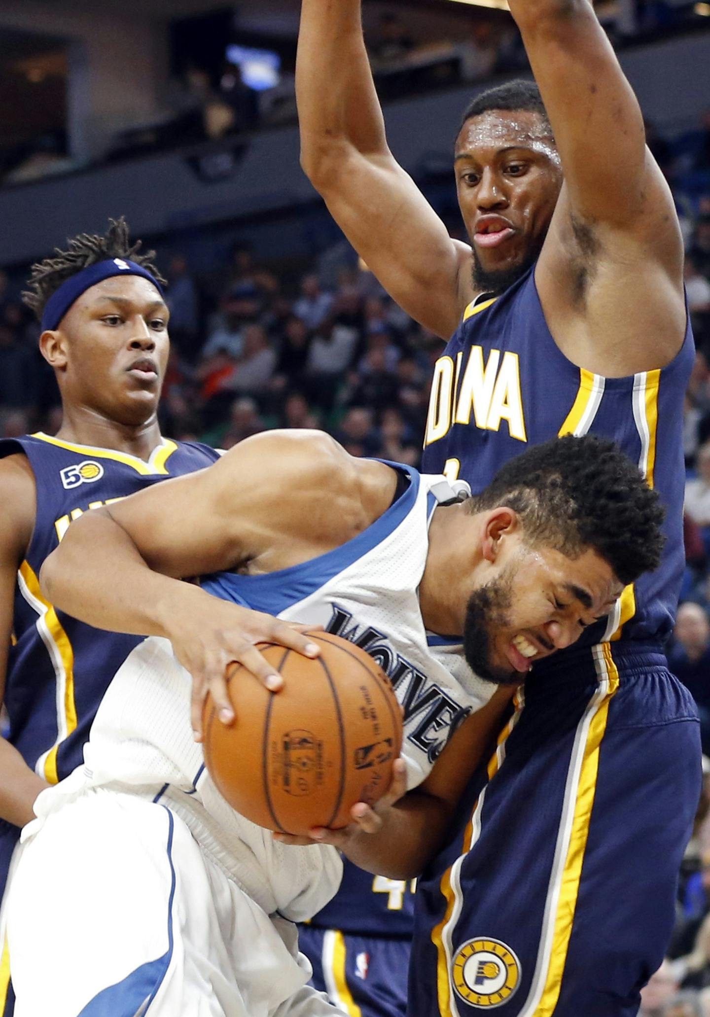 Minnesota Timberwolves' Karl-Anthony Towns, front left, runs into Indiana Pacers' Thaddeus Young during the first quarter of an NBA basketball game Thursday, Jan. 26, 2017, in Minneapolis. (AP Photo/Jim Mone)